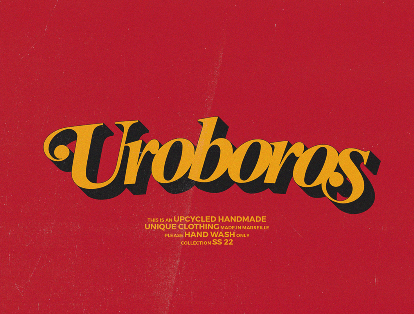 Uroboros est une marque d'upcycling basée à Marseille. Sur cette image le logo en jaune et noir avec un style année 70-80, le fond est rouge.