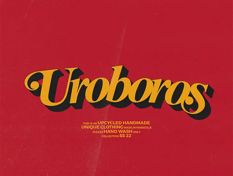 Uroboros est une marque d'upcycling basée à Marseille. Sur cette image le logo en jaune et noir avec un style année 70-80, le fond est rouge. Version mobile